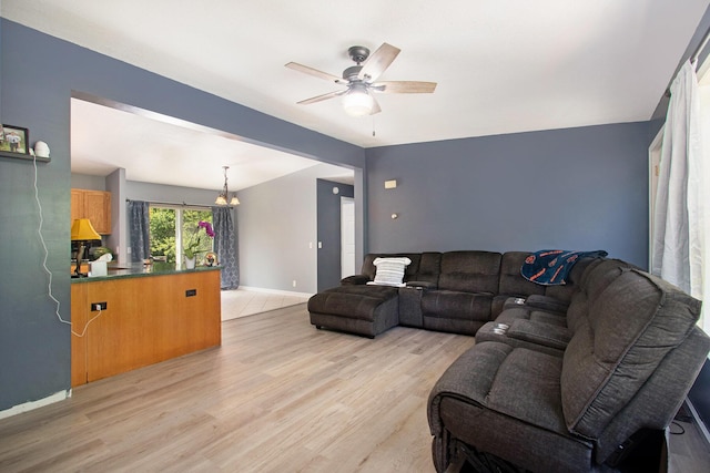 1417 Greenhouse Rd, Bangor, MI 49013 - living area featuring a ceiling fan, light wood finished floors, and baseboards