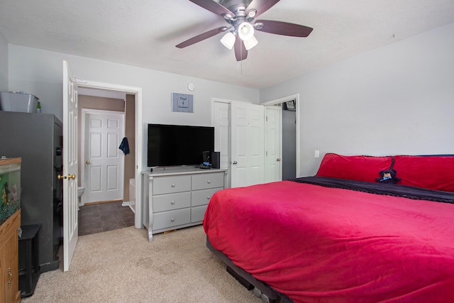 1417 Greenhouse Rd, Bangor, MI 49013 - bedroom featuring light carpet, a ceiling fan, and a closet