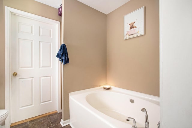 1417 Greenhouse Rd, Bangor, MI 49013 - full bath with a garden tub, toilet, baseboards, and tile patterned flooring