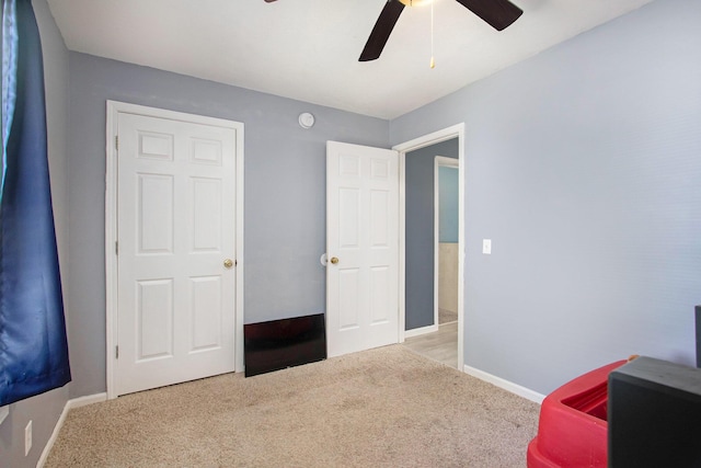 1417 Greenhouse Rd, Bangor, MI 49013 - unfurnished bedroom with carpet flooring, baseboards, and ceiling fan