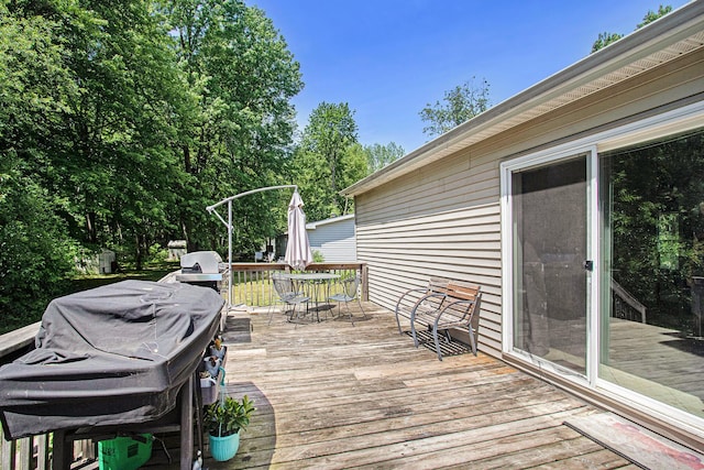 1417 Greenhouse Rd, Bangor, MI 49013 - wooden deck featuring outdoor dining space and area for grilling