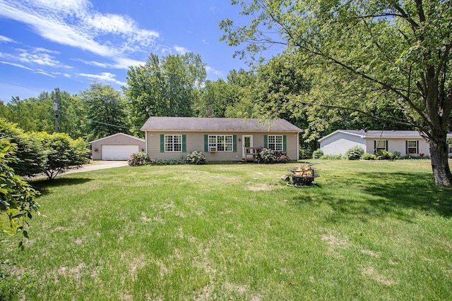 1417 Greenhouse Rd, Bangor, MI 49013 - ranch-style house with an outbuilding, a garage, a front lawn, and an outdoor fire pit