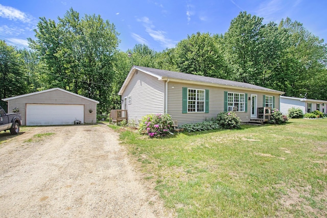1417 Greenhouse Rd, Bangor, MI 49013 - view of front facade with an outdoor structure, a detached garage, a front lawn, and entry steps