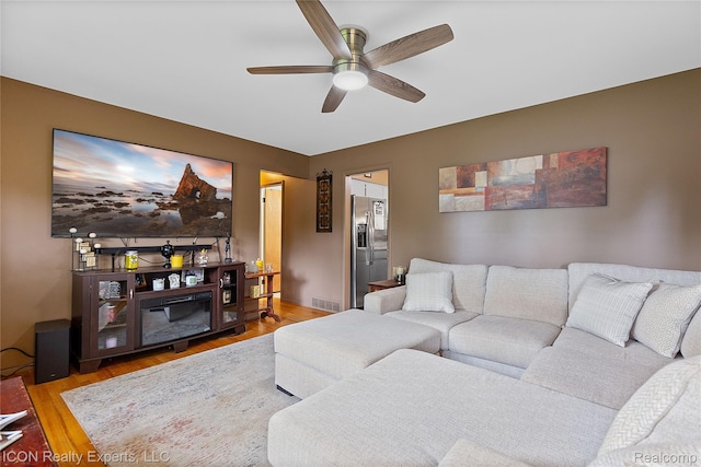 38505 Littlefield Dr, Sterling Heights, MI 48312 - living room with a ceiling fan and wood finished floors