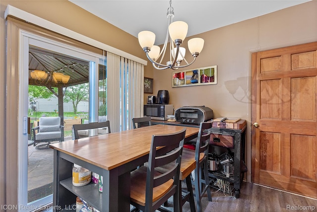 38505 Littlefield Dr, Sterling Heights, MI 48312 - dining space with a chandelier and dark wood-style floors