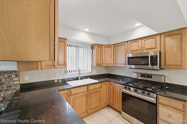 2430 Fox Hill Dr, Sterling Heights, MI 48310 - kitchen with appliances with stainless steel finishes, a sink, decorative backsplash, dark stone countertops, and recessed lighting