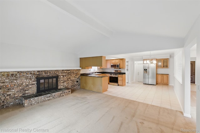 2430 Fox Hill Dr, Sterling Heights, MI 48310 - kitchen with stainless steel appliances, dark countertops, light carpet, a chandelier, and a sink