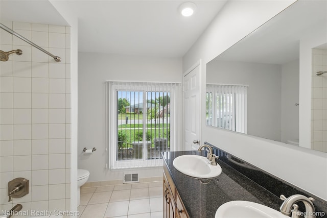 2430 Fox Hill Dr, Sterling Heights, MI 48310 - full bath featuring toilet, double vanity, tile patterned flooring, and healthy amount of natural light