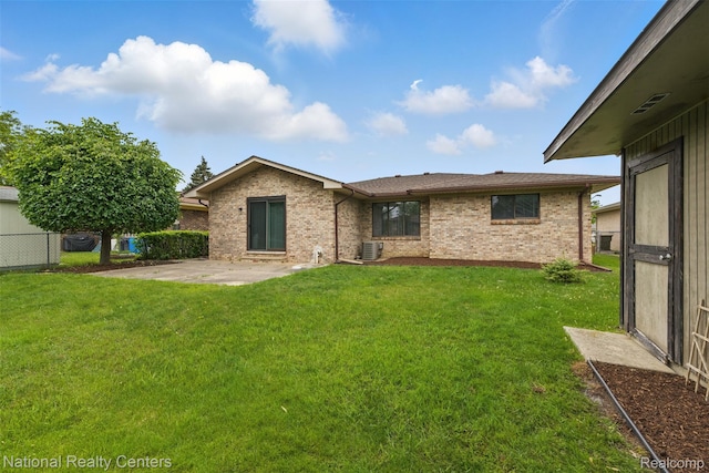 2430 Fox Hill Dr, Sterling Heights, MI 48310 - back of house with a patio, brick siding, and central AC