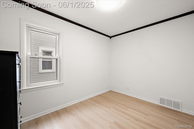 22923 Madison St, Dearborn, MI 48124 - empty room with ornamental molding, wood finished floors, and baseboards