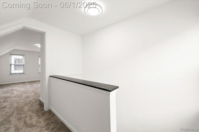 22923 Madison St, Dearborn, MI 48124 - corridor with an upstairs landing, vaulted ceiling, carpet floors, and baseboards