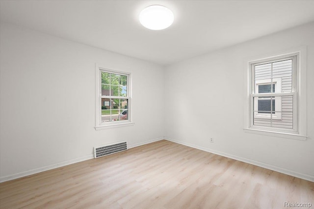 22923 Madison St, Dearborn, MI 48124 - empty room with light wood-style floors and baseboards