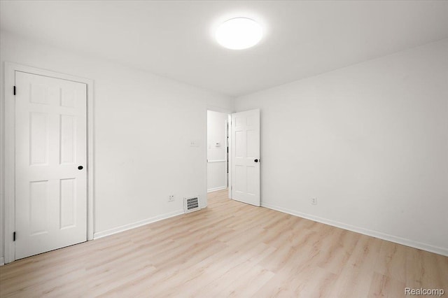 22923 Madison St, Dearborn, MI 48124 - unfurnished bedroom featuring light wood finished floors and baseboards