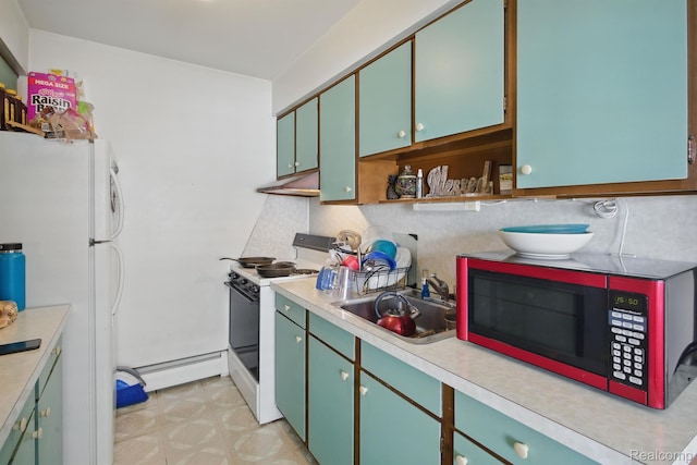 4811 Briarwood Ave, Royal Oak, MI 48073 - kitchen featuring stove, a sink, light countertops, freestanding refrigerator, and a baseboard heating unit
