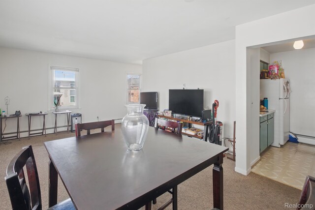 4811 Briarwood Ave, Royal Oak, MI 48073 - dining space featuring baseboard heating, light colored carpet, baseboards, and a baseboard radiator