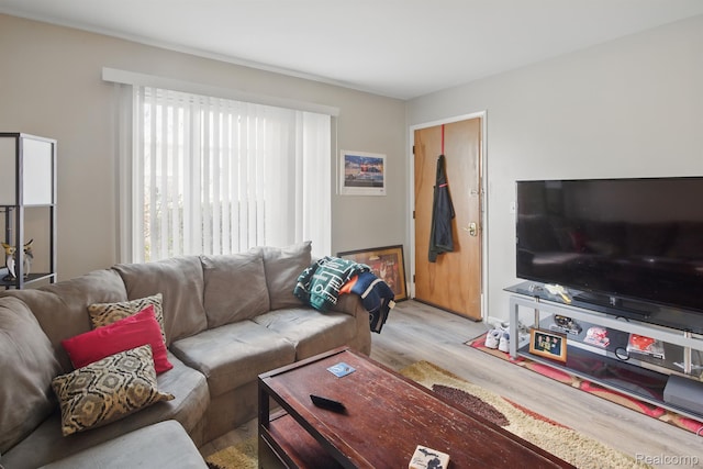 4811 Briarwood Ave, Royal Oak, MI 48073 - living room with plenty of natural light, wood finished floors, and baseboards