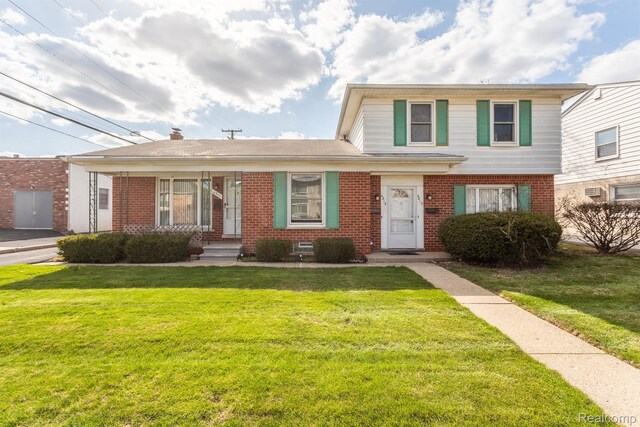 4811 Briarwood Ave, Royal Oak, MI 48073 - traditional home with brick siding and a front lawn