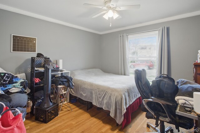4811 Briarwood Ave, Royal Oak, MI 48073 - bedroom with crown molding, light wood-type flooring, and ceiling fan