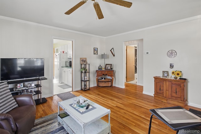 4811 Briarwood Ave, Royal Oak, MI 48073 - living area featuring ceiling fan, crown molding, wood finished floors, and baseboards