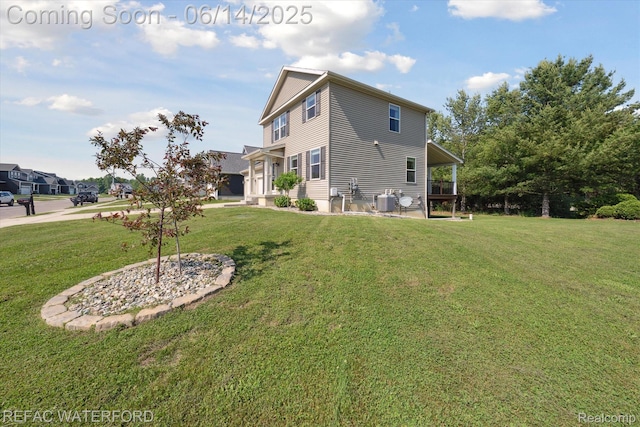 5200 Autumn Kirsten Dr, Fowlerville, MI 48836 - back of property with a lawn