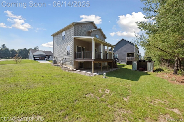 5200 Autumn Kirsten Dr, Fowlerville, MI 48836 - back of house with a yard and a storage unit