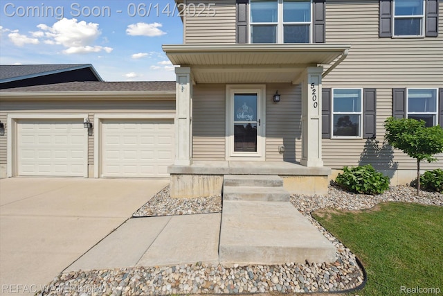 5200 Autumn Kirsten Dr, Fowlerville, MI 48836 - entrance to property featuring an attached garage and concrete driveway