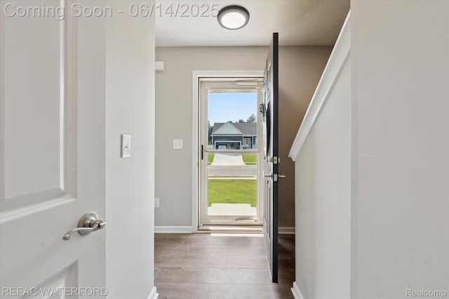 5200 Autumn Kirsten Dr, Fowlerville, MI 48836 - entryway featuring wood finished floors and baseboards