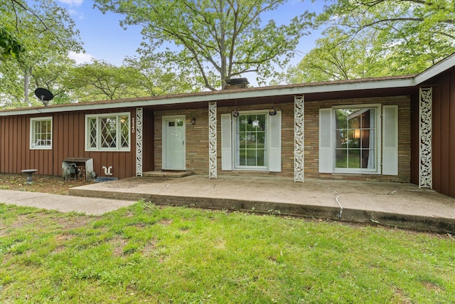 2240 S 13th St, Niles, MI 49120 - ranch-style home with board and batten siding, a front yard, and covered porch