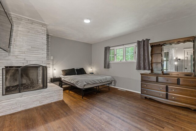 2240 S 13th St, Niles, MI 49120 - bedroom with wood finished floors and a large fireplace