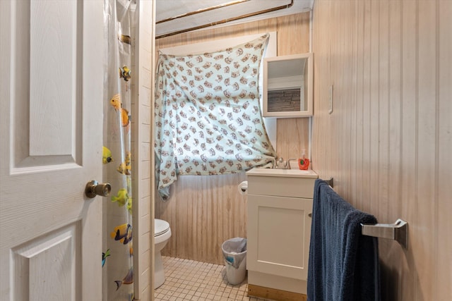 2240 S 13th St, Niles, MI 49120 - bathroom featuring vanity, wooden walls, and tile patterned floors
