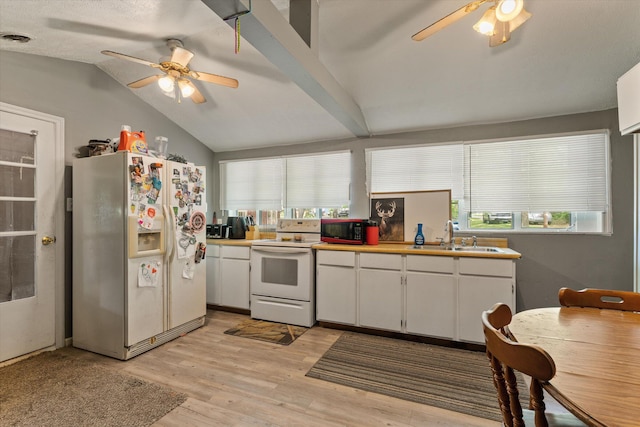 2240 S 13th St, Niles, MI 49120 - kitchen with white appliances, ceiling fan, vaulted ceiling, and plenty of natural light