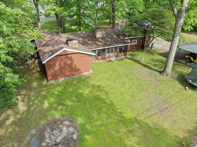 2240 S 13th St, Niles, MI 49120 - view of green lawn featuring a trampoline and a storage unit
