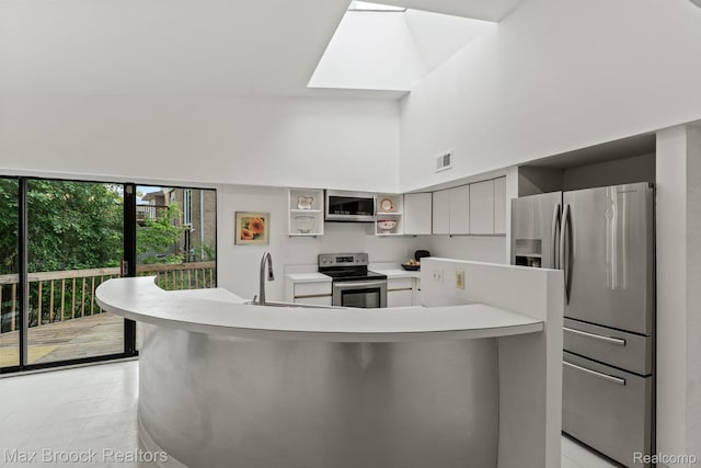 4355 Middleton Dr, Bloomfield Hills, MI 48302 - kitchen featuring appliances with stainless steel finishes, a sink, light countertops, open shelves, and a high ceiling