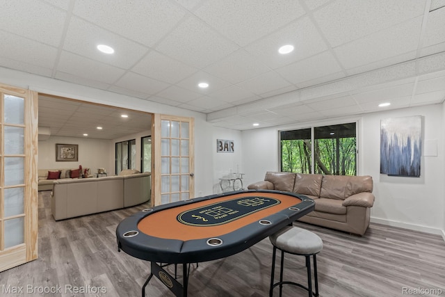 4355 Middleton Dr, Bloomfield Hills, MI 48302 - game room with wood finished floors, baseboards, recessed lighting, french doors, and a drop ceiling