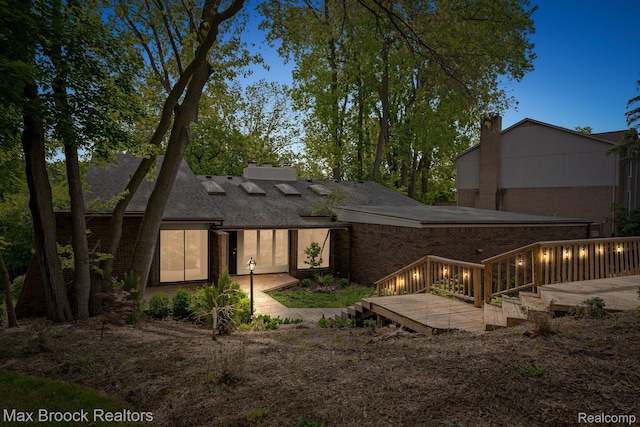 4355 Middleton Dr, Bloomfield Hills, MI 48302 - back of property featuring a wooden deck, a chimney, brick siding, and a shingled roof