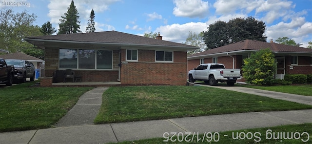 26312 Warrington St, Dearborn Heights, MI 48127 - bungalow-style house with brick siding, a front lawn, a chimney, and concrete driveway