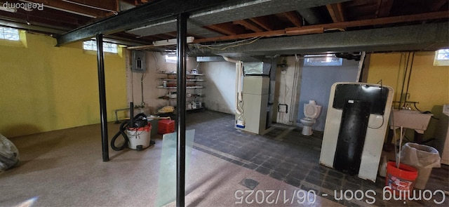 26312 Warrington St, Dearborn Heights, MI 48127 - below grade area with electric panel, heating unit, plenty of natural light, and a sink