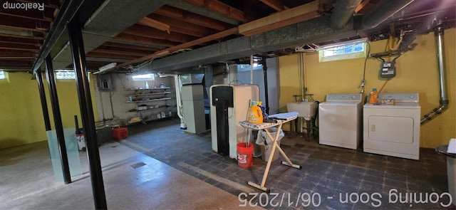 26312 Warrington St, Dearborn Heights, MI 48127 - basement featuring separate washer and dryer, tile patterned floors, healthy amount of natural light, and gas meter