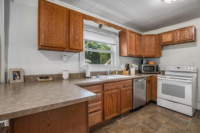 241 E Corey St, Bronson, MI 49028 - kitchen featuring appliances with stainless steel finishes, a sink, and brown cabinets