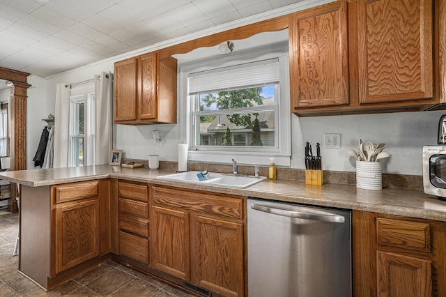 241 E Corey St, Bronson, MI 49028 - kitchen featuring stainless steel dishwasher, a sink, a peninsula, brown cabinets, and ornamental molding