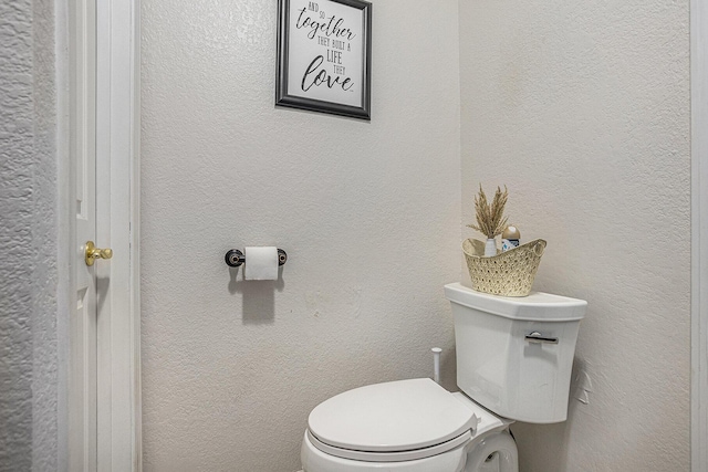 241 E Corey St, Bronson, MI 49028 - bathroom featuring toilet and a textured wall