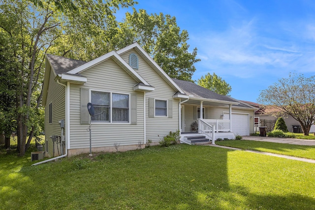1407 S Dibble St, Hastings, MI 49058 - view of front of property featuring an attached garage, driveway, a front yard, and a porch