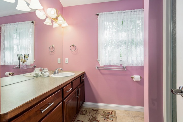 1407 S Dibble St, Hastings, MI 49058 - bathroom featuring healthy amount of natural light, vanity, baseboards, and tile patterned floors