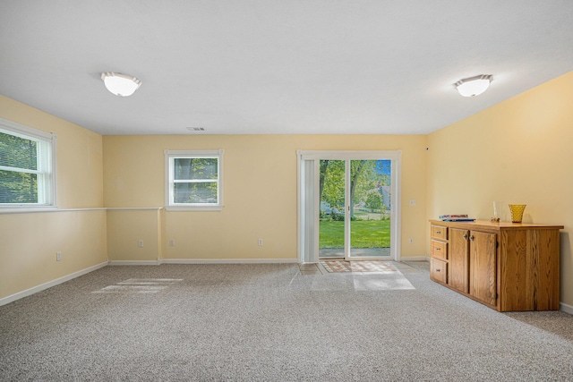 1407 S Dibble St, Hastings, MI 49058 - spare room featuring baseboards and light colored carpet