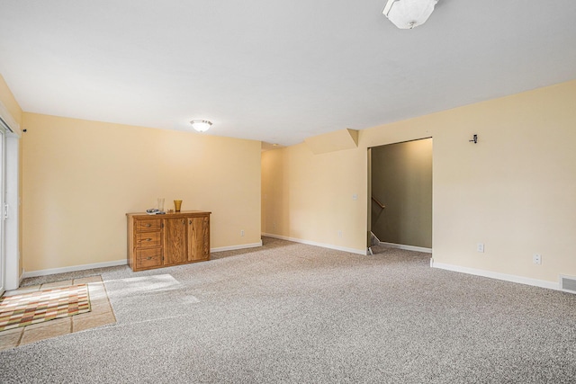 1407 S Dibble St, Hastings, MI 49058 - empty room featuring light carpet, stairway, and baseboards