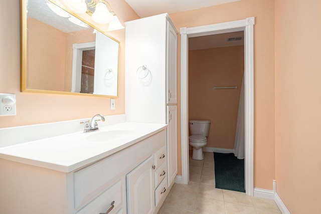 1407 S Dibble St, Hastings, MI 49058 - full bathroom featuring vanity, tile patterned flooring, toilet, and baseboards