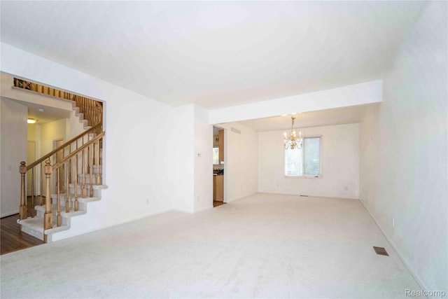6169 Valley View Dr, Canton, MI 48187 - unfurnished living room featuring a chandelier, carpet floors, and stairway