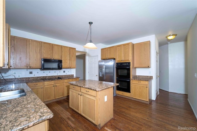 6169 Valley View Dr, Canton, MI 48187 - kitchen featuring black appliances, dark wood-type flooring, light stone counters, a center island, and decorative backsplash