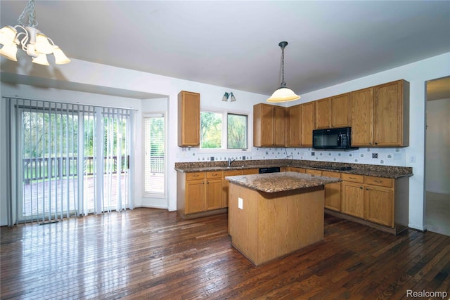 6169 Valley View Dr, Canton, MI 48187 - kitchen featuring black appliances, a sink, a center island, dark wood-type flooring, and a chandelier