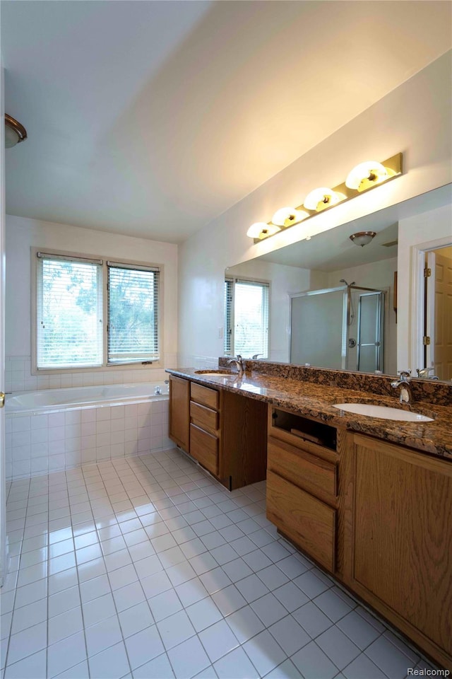 6169 Valley View Dr, Canton, MI 48187 - bathroom featuring tile patterned floors, double vanity, a stall shower, and a garden tub
